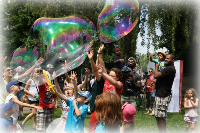 Children blowing huge bubbles